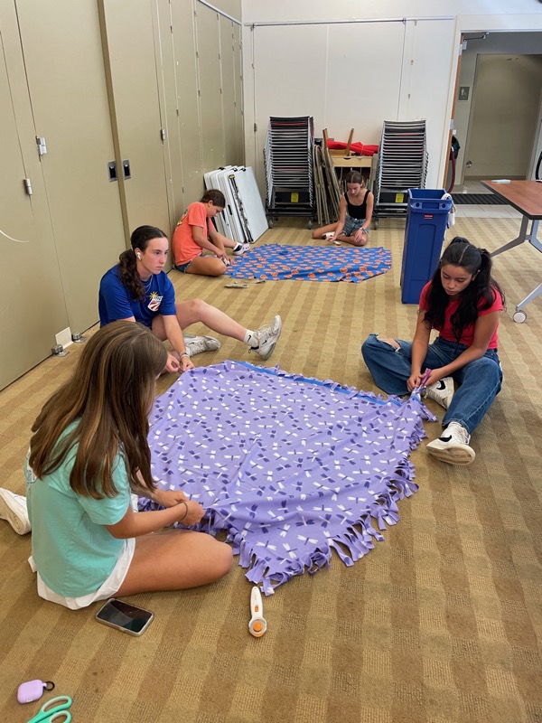 Ramsey Blanket Corps community members with completed blankets