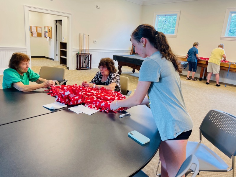 Senior group volunteers with handmade blankets in Ramsey NJ