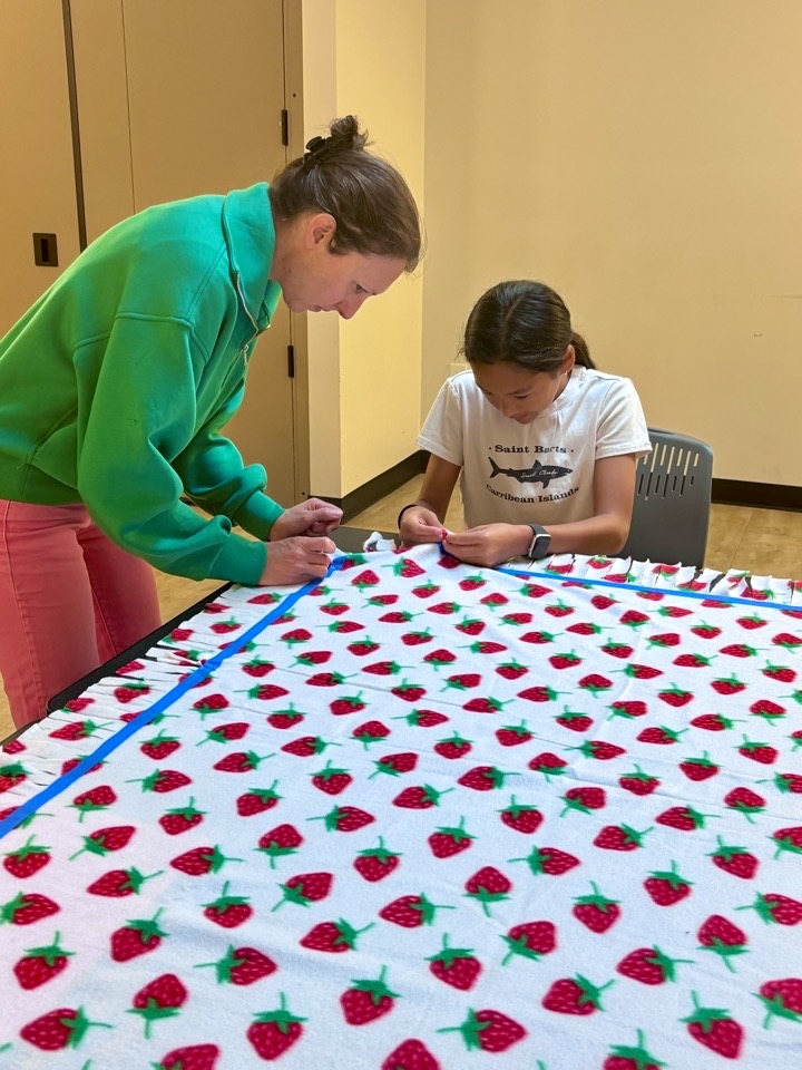 A completed handmade fleece tie blanket