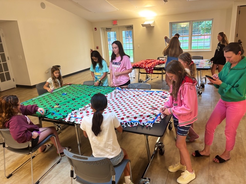 Participants at work during the August 30 blanket-making event
