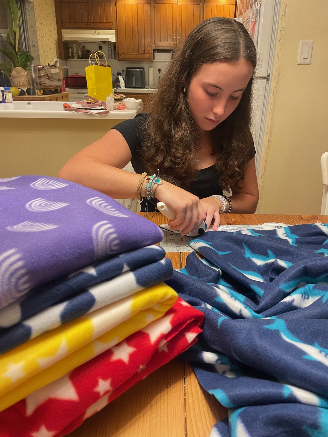 Community members presenting handmade blankets in Ramsey NJ