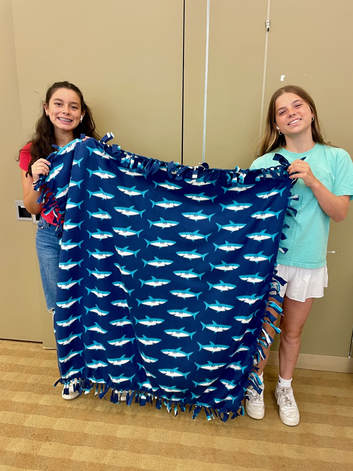 Girl Scout troop members with handmade blankets in Ramsey NJ