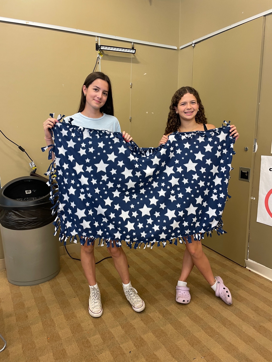 Ramsey Blanket Corps volunteer event with completed blankets