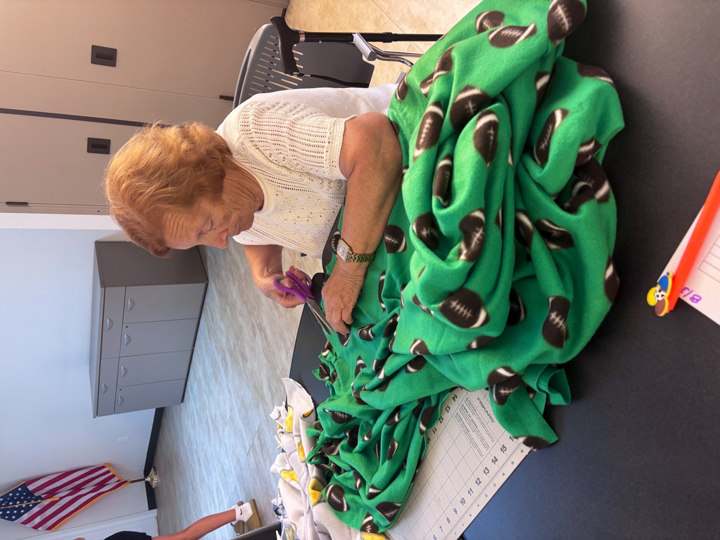 Community volunteers creating blankets together