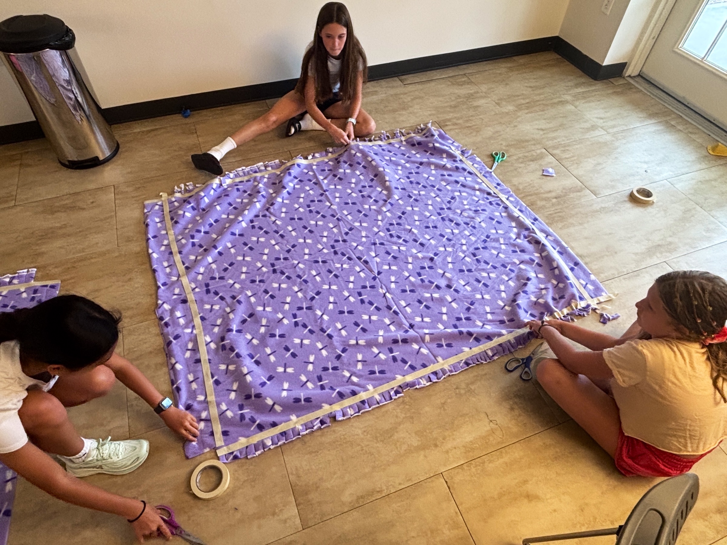 Colorful fleece blankets at the community event