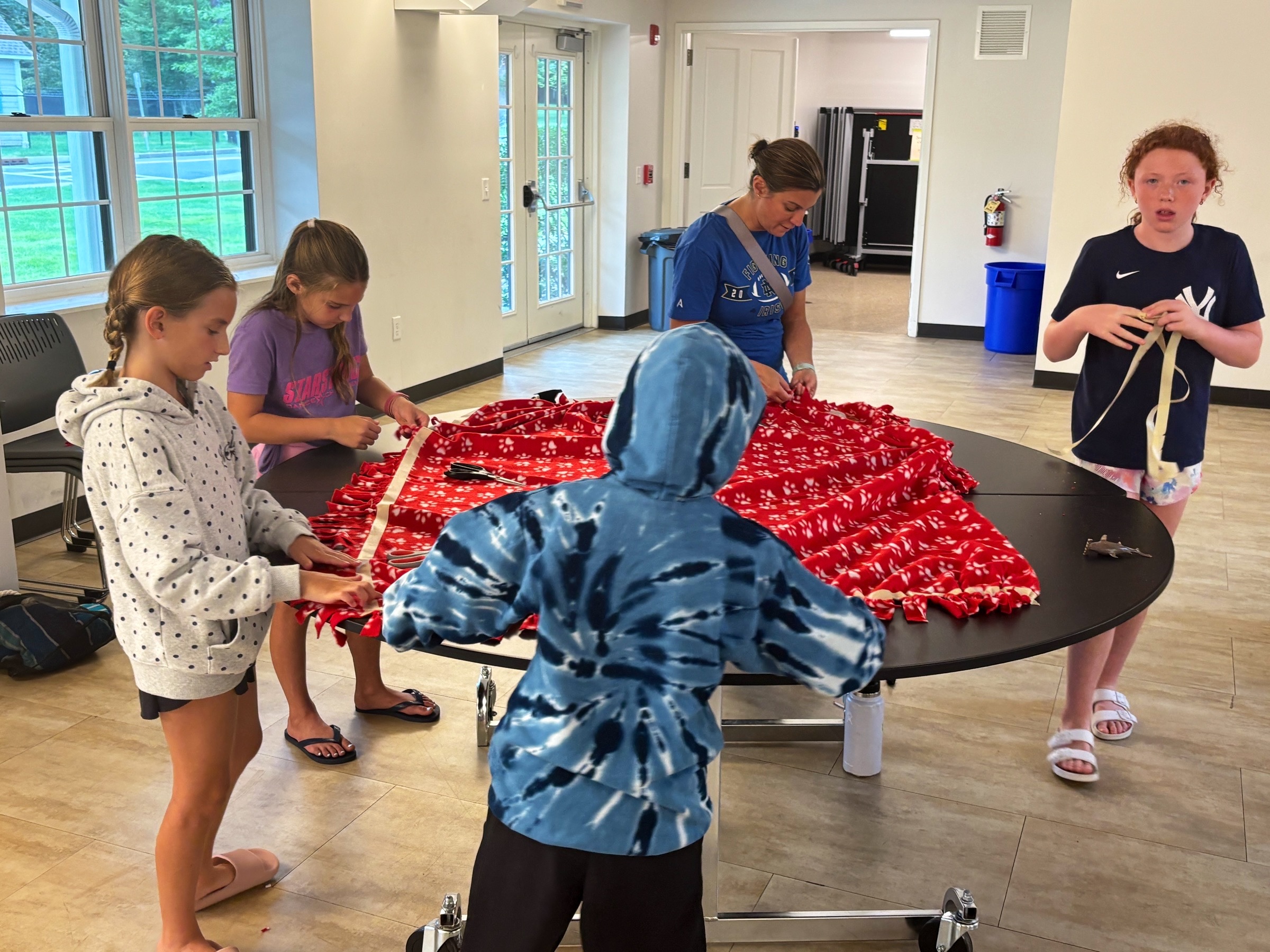 Participants creating blankets together at the August 30 event