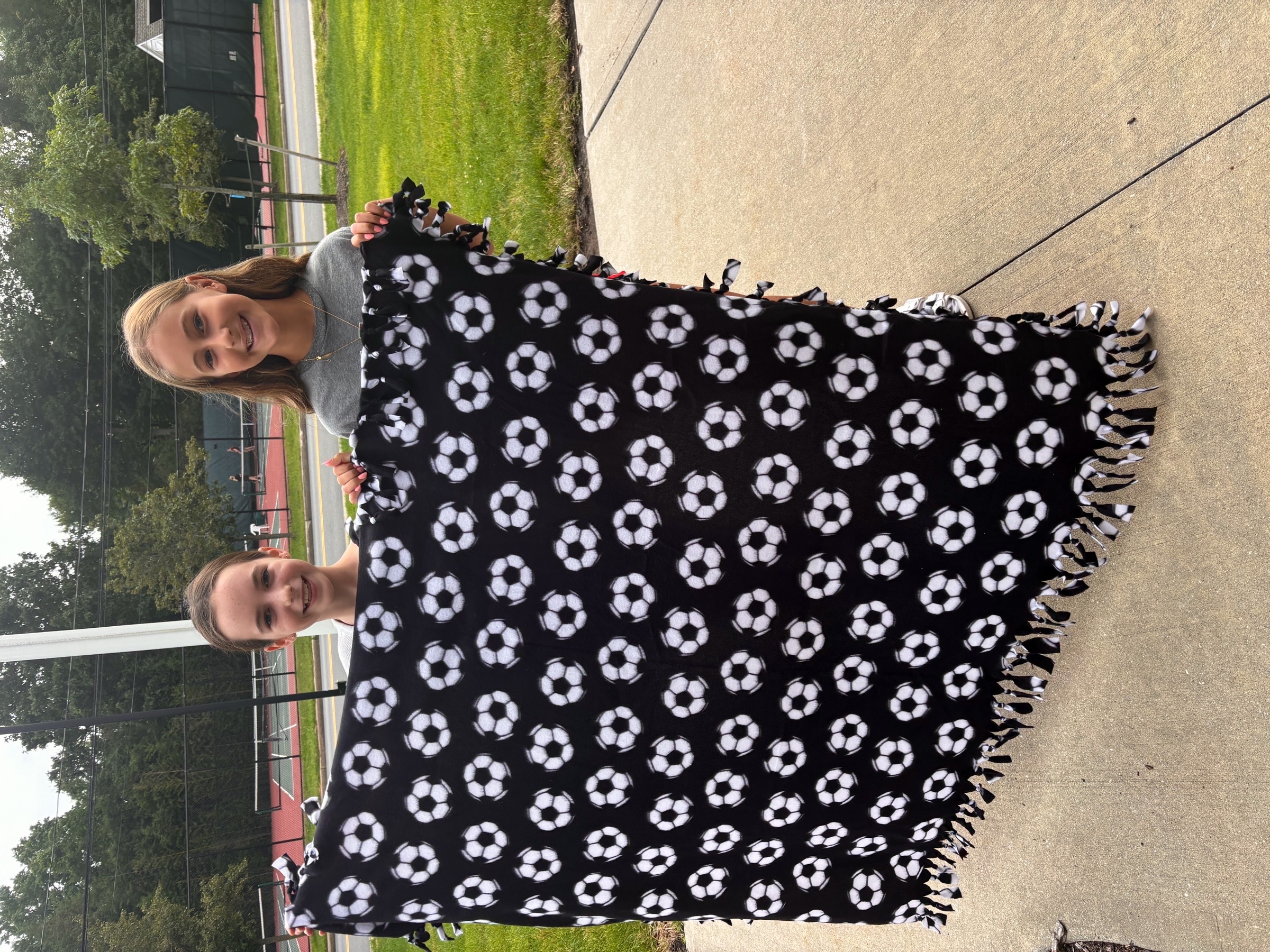 Community volunteers with their fleece tie blanket project